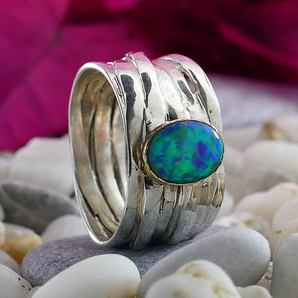 Natural Red Garnet Gemstone Two Tone Solid 9k Yellow Gold & 925 Sterling Silver Wrap Ring Main Stone: Opal Thickness mm: 2 Sizable: Yes Hight Above The Finger mm: 5 Width mm: 11 Total Carat Weight (TCW): 1.7 Weight gr.: 6.3