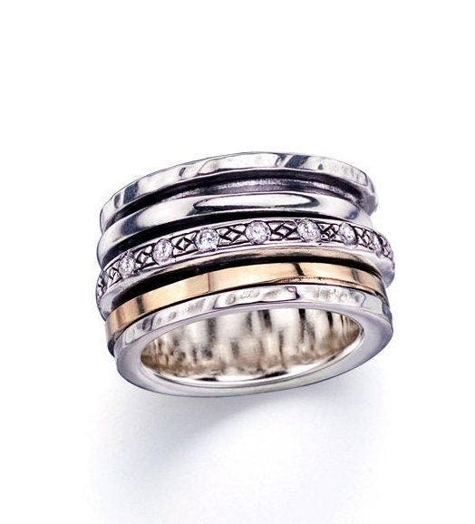 Cubic Zirconia Stone Two Tone Solid 9k Yellow Gold & 925 Sterling Silver Spinner Ring Metal Purity: 9k Spinner rings quantity: 3 Total Carat Weight (TCW): 0.6 Thickness mm: 3 Width mm: 11.5 Weight gr.: 13.2