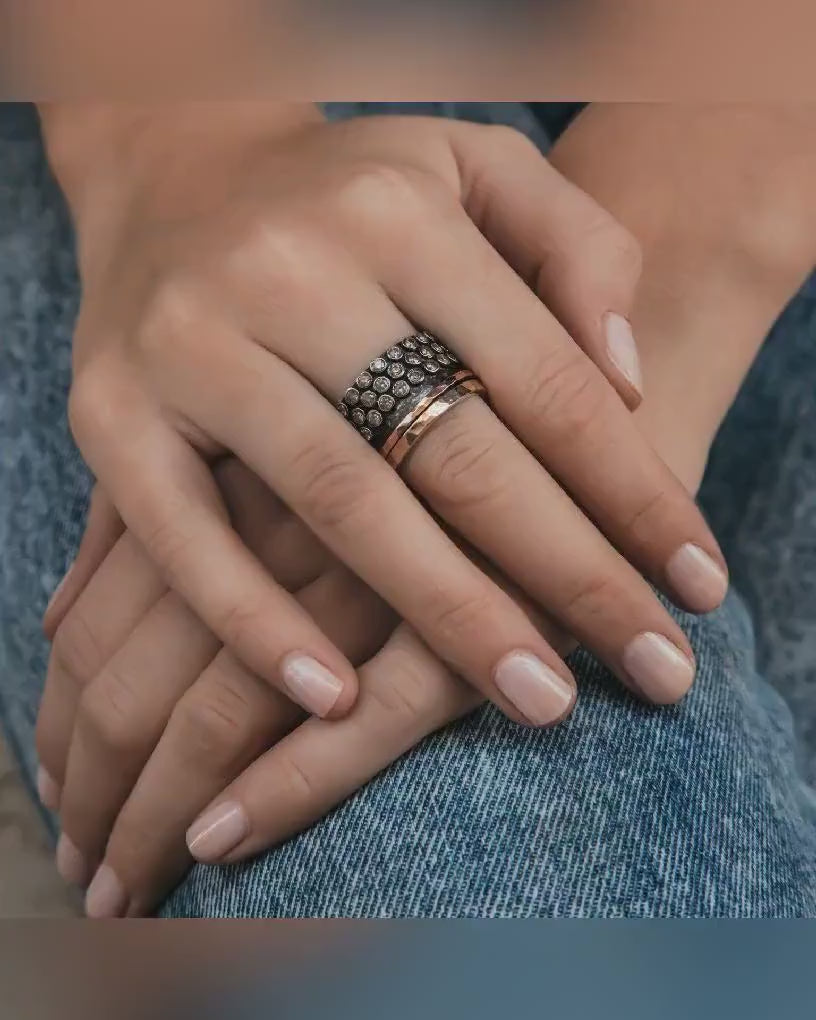 Enchanted Swirls: Silver and Gold Spinner Ring with CZ setting that Capture the Imagination