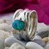 Blue Opal Stone Two Tone Solid 9k Yellow Gold & 925 Sterling Silver Wrap Ring Main Stone: Doublet Opals Thickness mm: 2 Sizable: Yes Hight Above The Finger mm: 3.5 Width mm: 10 Band Color: Silver Weight gr.: 6.2 Total Carat Weight (TCW): 0.9