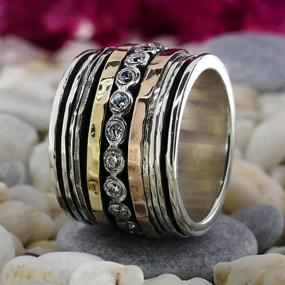 White Cubic Zirconia Stone Two Tone Solid 9k Yellow &amp; Rose Gold 925 Sterling Silver Spinner Ring Total Carat Weight: 1.50 - 1.74 Thickness mm: 3 Occasion: Anniversary Width mm: 17 Weight gr.: 17.3 Total Carat Weight (TCW): 1.6