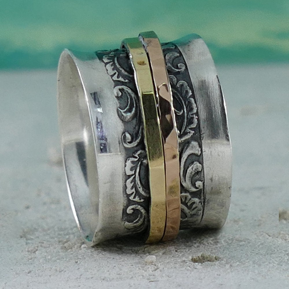 A Symphony of Textures: Unique Silver and Gold Spinner Rings that Engage Your Senses