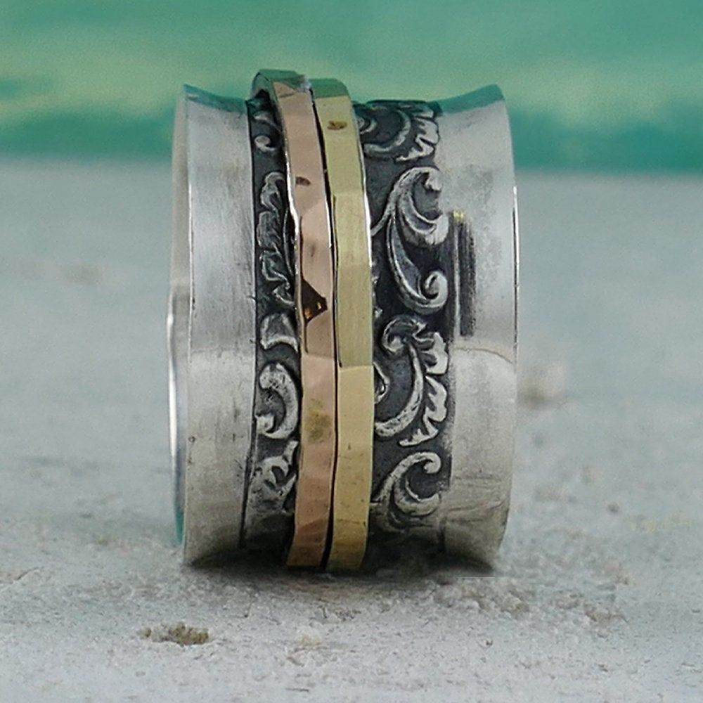 A Symphony of Textures: Unique Silver and Gold Spinner Rings that Engage Your Senses