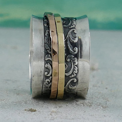 A Symphony of Textures: Unique Silver and Gold Spinner Rings that Engage Your Senses
