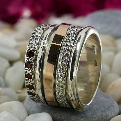 Natural Red Garnet Gemstone Two Tone Solid 9k Rose Gold &amp; 925 Sterling Silver Spinner Ring Main Stone: Garnet Main Stone Creation: Natural Total Carat Weight (TCW): 0.4 Spinner rings quantity: 3 Thickness mm: 2.5 Width mm: 14.5 Weight gr.: 11.7