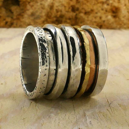 Handcrafted Masterpieces: Unique Silver and Gold Spinner Rings that Exude Artistic Flair