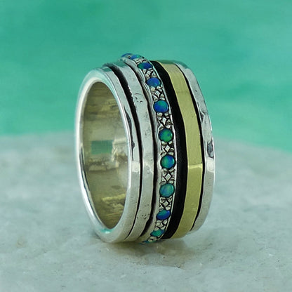 A Symphony of Textures: Unique Silver and Gold Opal Spinner Rings that Engage Your Senses