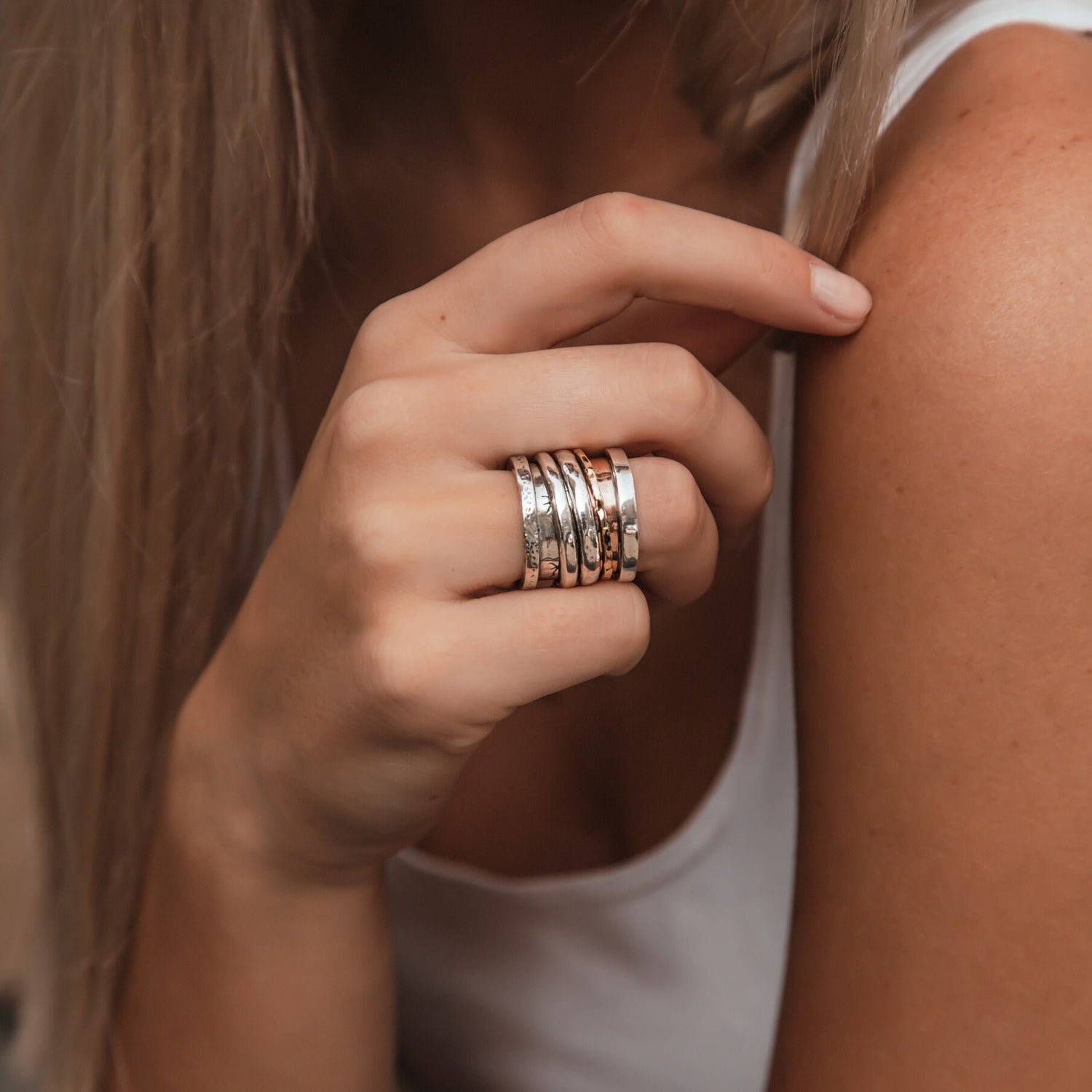 Handcrafted Masterpieces: Unique Silver and Gold Spinner Rings that Exude Artistic Flair