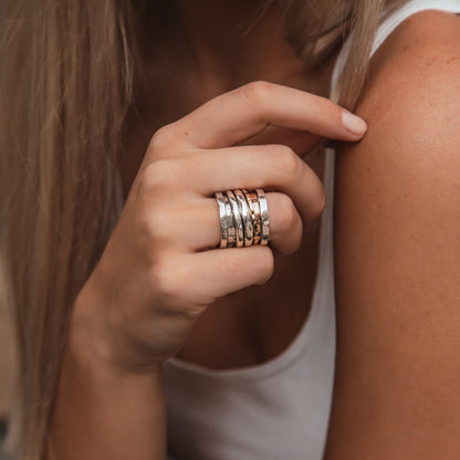 Handcrafted Masterpieces: Unique Silver and Gold Spinner Rings that Exude Artistic Flair