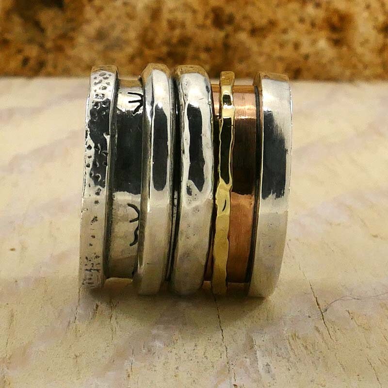 Handcrafted Masterpieces: Unique Silver and Gold Spinner Rings that Exude Artistic Flair