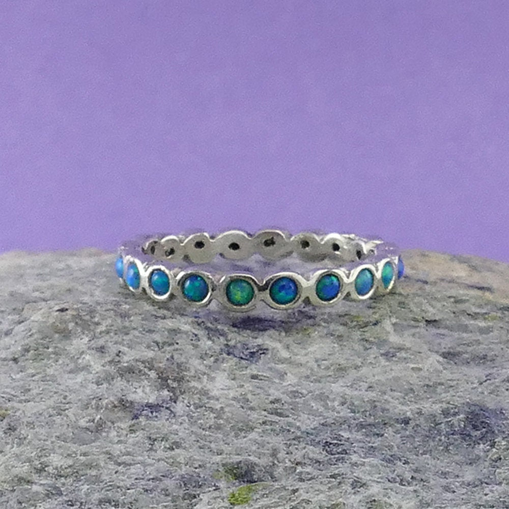 Timeless Opulence: Sterling Silver Eternity Opals Ring